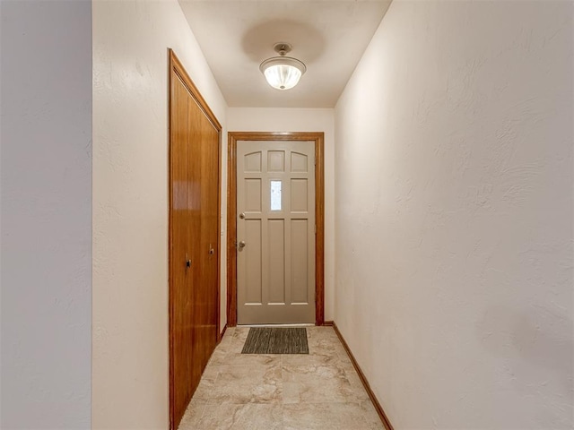 doorway with baseboards