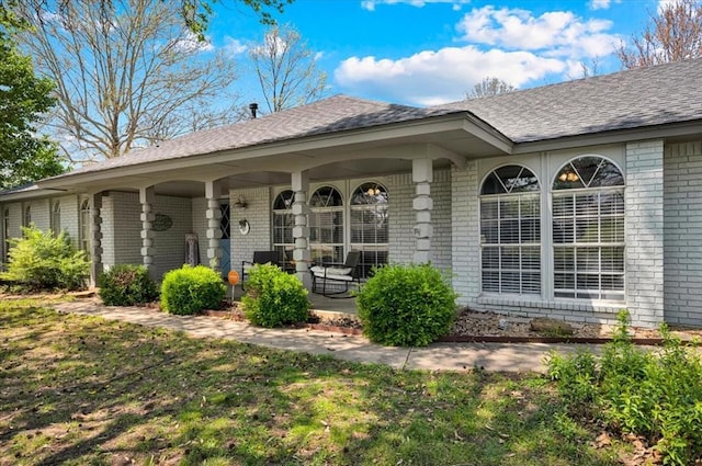 2315 Grisso Dr, Seminole, OK 74868 - view of exterior entry with brick siding and covered porch