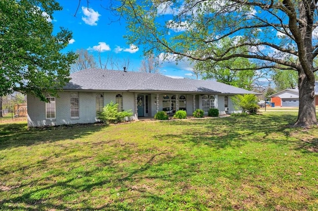 2315 Grisso Dr, Seminole, OK 74868 - view of front facade with a front lawn and brick siding