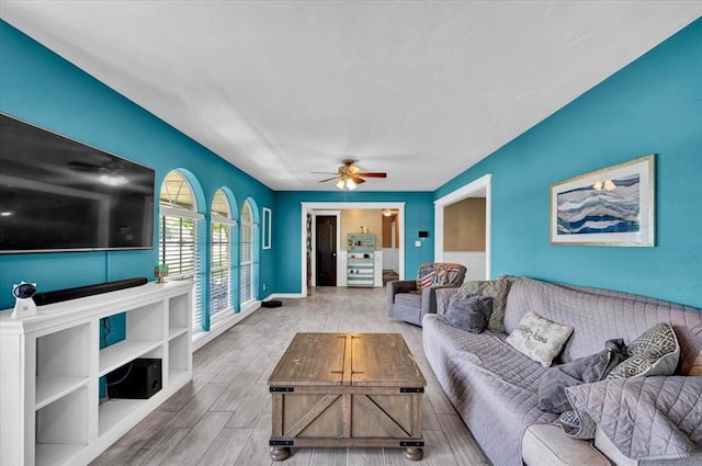 2315 Grisso Dr, Seminole, OK 74868 - living room featuring wood finished floors, ceiling fan, and baseboards