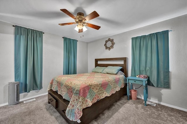 2315 Grisso Dr, Seminole, OK 74868 - bedroom with visible vents, ceiling fan, baseboards, and carpet