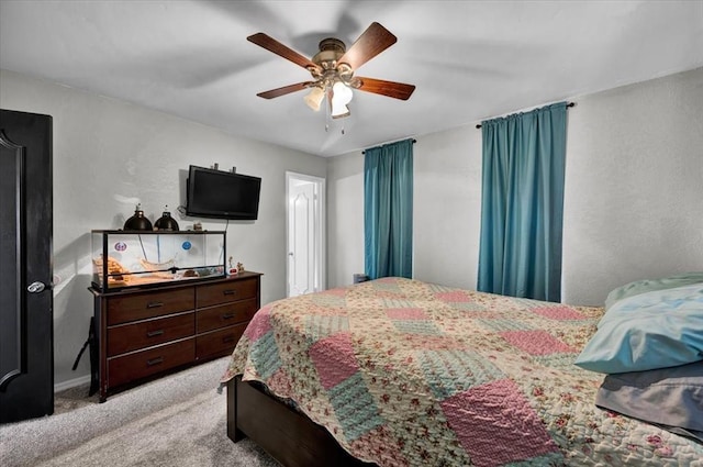 2315 Grisso Dr, Seminole, OK 74868 - bedroom featuring light carpet, a textured wall, and a ceiling fan