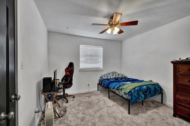 2315 Grisso Dr, Seminole, OK 74868 - bedroom with baseboards, a ceiling fan, and carpet
