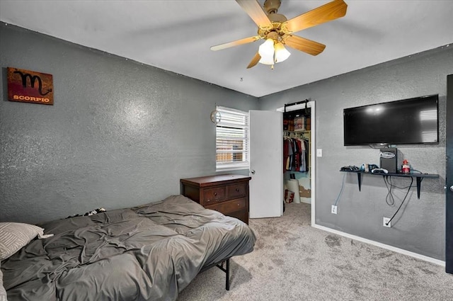 2315 Grisso Dr, Seminole, OK 74868 - bedroom with a textured wall, a walk in closet, light colored carpet, and a closet
