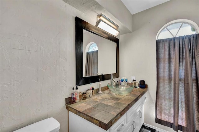 2315 Grisso Dr, Seminole, OK 74868 - half bathroom featuring vanity and toilet