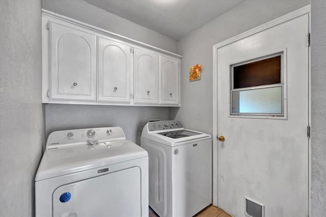 2315 Grisso Dr, Seminole, OK 74868 - laundry area featuring cabinet space and washer and clothes dryer