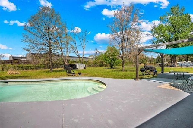 2315 Grisso Dr, Seminole, OK 74868 - view of pool featuring an outbuilding, a storage shed, a lawn, and a patio area