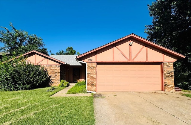 100 N Rockypoint Dr, Edmond, OK 73003 - ranch-style home with brick siding, a front lawn, concrete driveway, a garage, and stucco siding