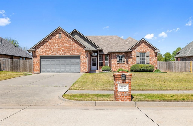 1240 Penny Ln, El Reno, OK 73036 - single story home featuring a front lawn, driveway, fence, and a garage