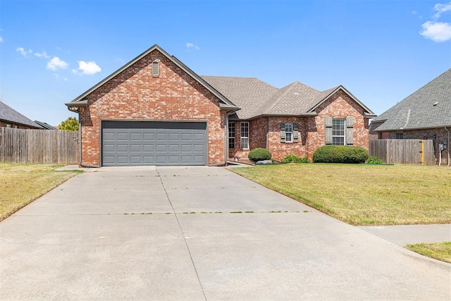 1240 Penny Ln, El Reno, OK 73036 - ranch-style home featuring an attached garage, fence, a front yard, and driveway