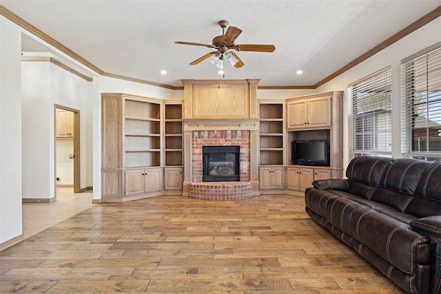 1240 Penny Ln, El Reno, OK 73036 - living area with light wood-type flooring, ornamental molding, a fireplace, and ceiling fan