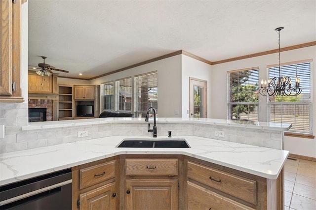 1240 Penny Ln, El Reno, OK 73036 - kitchen with a sink, crown molding, backsplash, and dishwashing machine
