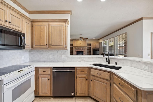 1240 Penny Ln, El Reno, OK 73036 - kitchen with a ceiling fan, stainless steel dishwasher, a sink, black microwave, and white range with electric cooktop