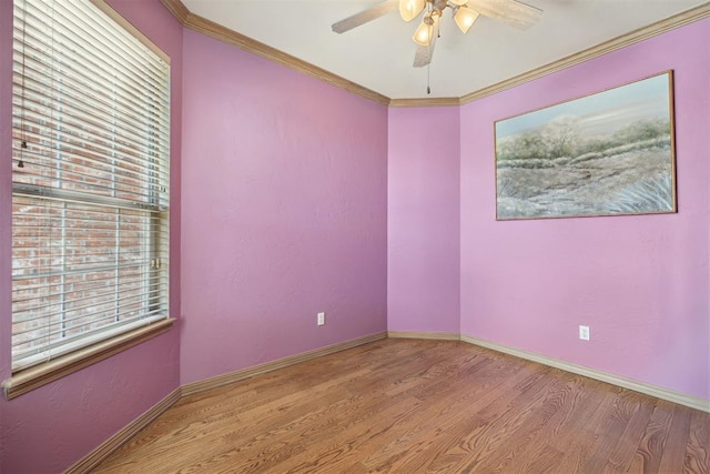 1240 Penny Ln, El Reno, OK 73036 - spare room featuring ornamental molding, wood finished floors, baseboards, and ceiling fan