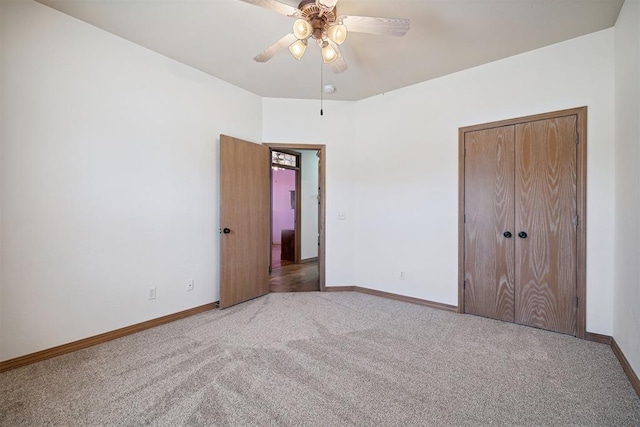 1240 Penny Ln, El Reno, OK 73036 - unfurnished bedroom with baseboards, a closet, ceiling fan, and carpet floors