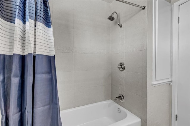 bathroom featuring shower / bath combo with shower curtain