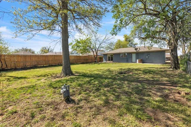 view of yard with a fenced backyard