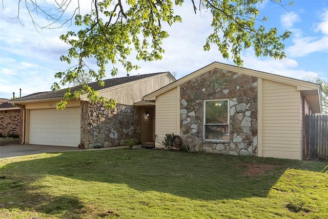ranch-style home with a front yard, an attached garage, stone siding, fence, and concrete driveway