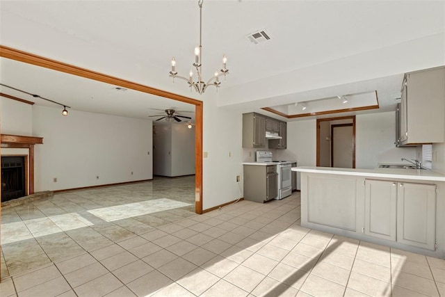 kitchen with visible vents, light countertops, under cabinet range hood, gray cabinetry, and white electric range oven