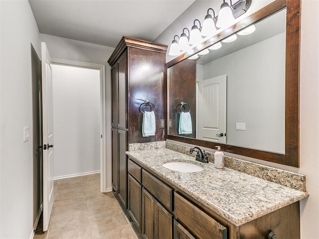 bathroom featuring tile patterned flooring and vanity