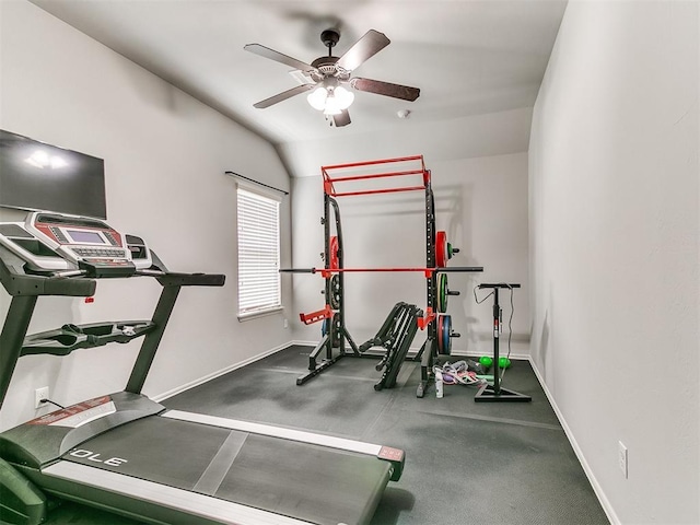 exercise room featuring lofted ceiling, ceiling fan, and baseboards