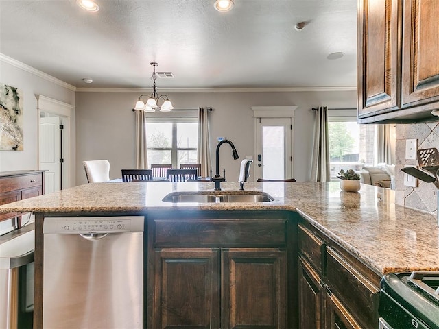 kitchen with an inviting chandelier, stainless steel dishwasher, gas range, a sink, and visible vents