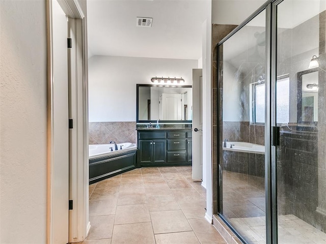 full bath with a shower stall, visible vents, a bath, vanity, and tile patterned flooring