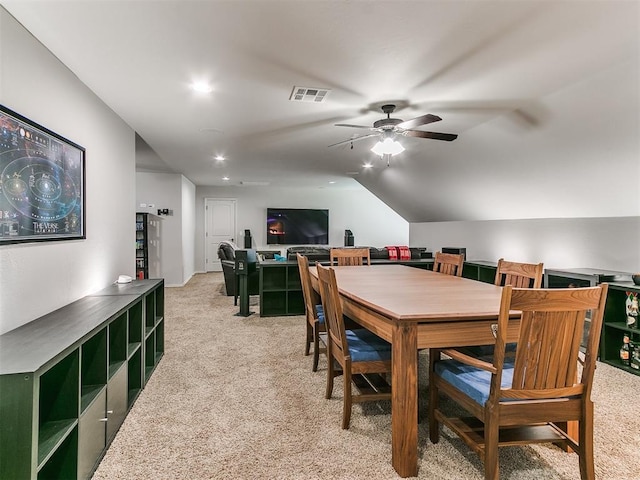 dining room featuring recessed lighting, a ceiling fan, visible vents, vaulted ceiling, and light carpet