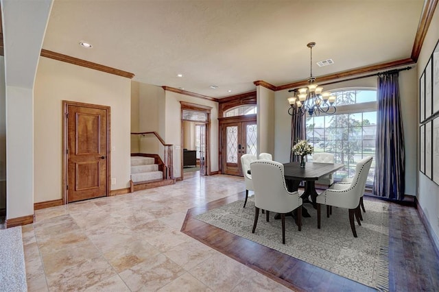 11016 Katie Beth Ln, Oklahoma City, OK 73170 - dining space with a chandelier, crown molding, stairway, and baseboards