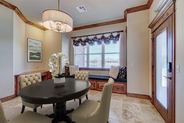 11016 Katie Beth Ln, Oklahoma City, OK 73170 - dining area with ornamental molding, baseboards, and a chandelier