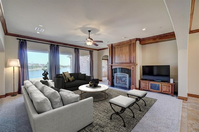 11016 Katie Beth Ln, Oklahoma City, OK 73170 - living area featuring baseboards, arched walkways, a high end fireplace, ornamental molding, and a ceiling fan