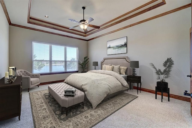 11016 Katie Beth Ln, Oklahoma City, OK 73170 - bedroom featuring a tray ceiling, crown molding, light carpet, baseboards, and ceiling fan