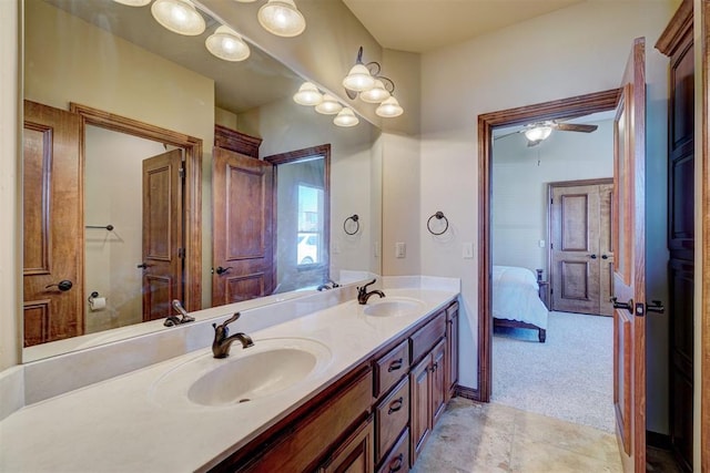 11016 Katie Beth Ln, Oklahoma City, OK 73170 - bathroom with double vanity, ensuite bath, and ceiling fan