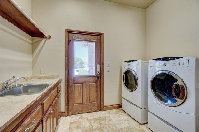 11016 Katie Beth Ln, Oklahoma City, OK 73170 - washroom with a sink, separate washer and dryer, and baseboards