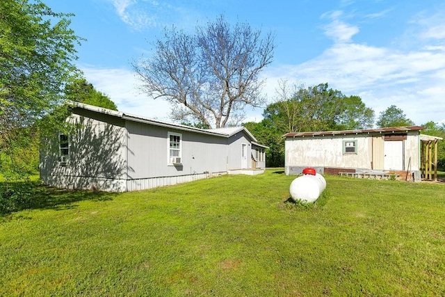 rear view of house with a yard