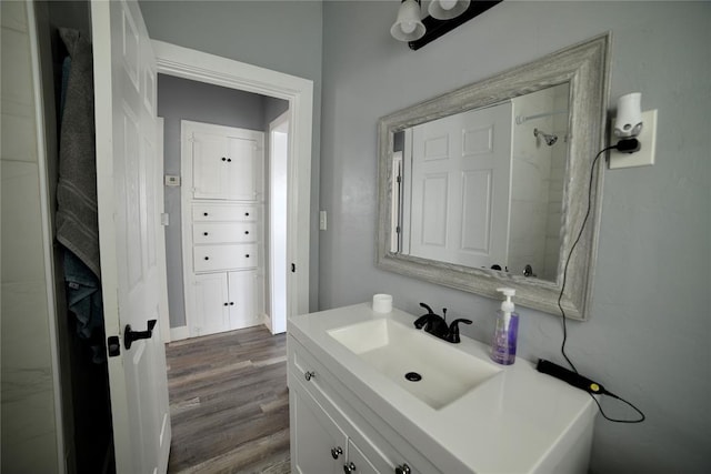bathroom featuring wood finished floors and vanity