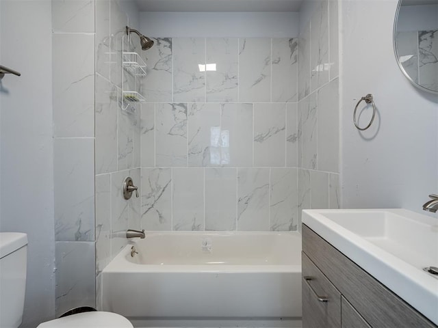 bathroom with toilet, vanity, and bathing tub / shower combination