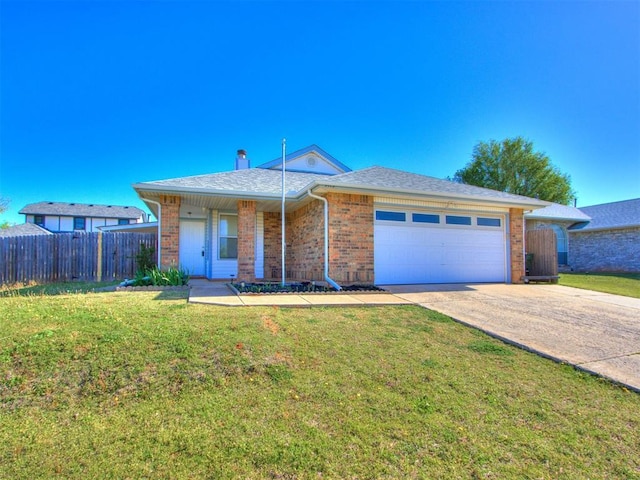 ranch-style house with an attached garage, fence, concrete driveway, brick siding, and a front lawn