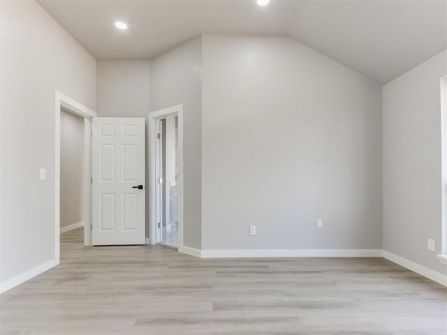 additional living space with light wood finished floors, baseboards, lofted ceiling, and recessed lighting