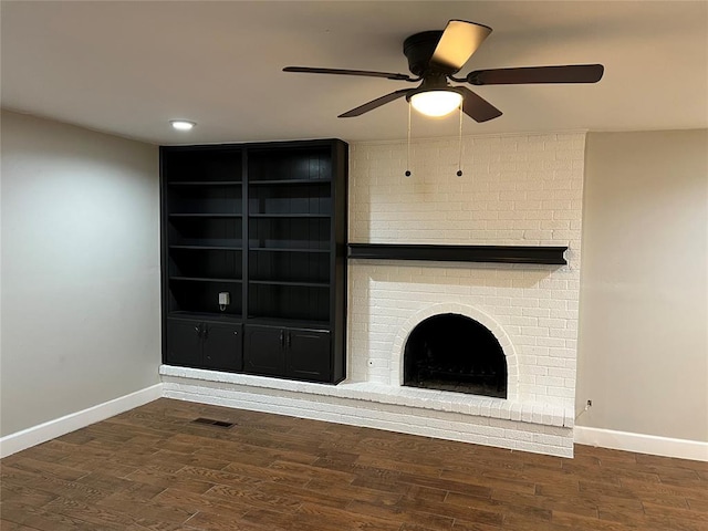 6804 Lancer Ln, Oklahoma City, OK 73132 - unfurnished living room featuring baseboards, a ceiling fan, a brick fireplace, visible vents, and wood finished floors