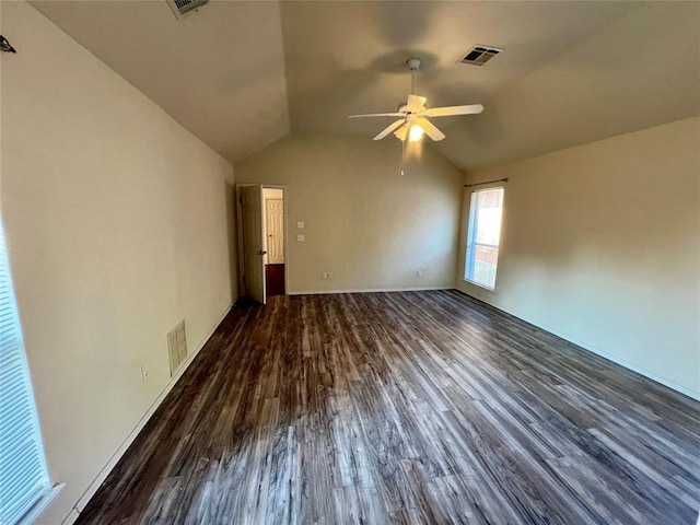 interior space with lofted ceiling, ceiling fan, visible vents, and wood finished floors
