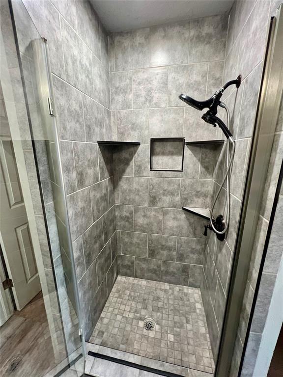 full bathroom with a stall shower