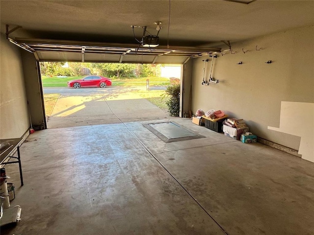 garage featuring a garage door opener
