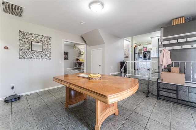 2428 SW 79th St, Oklahoma City, OK 73159 - tiled dining room with baseboards and visible vents