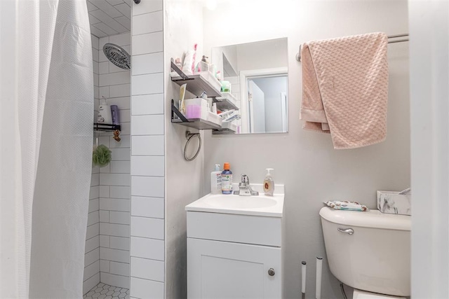 2428 SW 79th St, Oklahoma City, OK 73159 - bathroom with a tile shower, toilet, and vanity