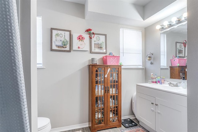 2428 SW 79th St, Oklahoma City, OK 73159 - full bath with toilet, vanity, and baseboards