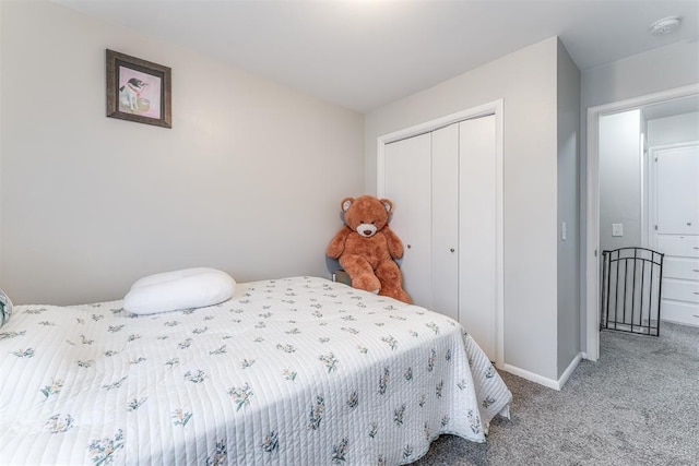 2428 SW 79th St, Oklahoma City, OK 73159 - bedroom with baseboards, carpet floors, and a closet