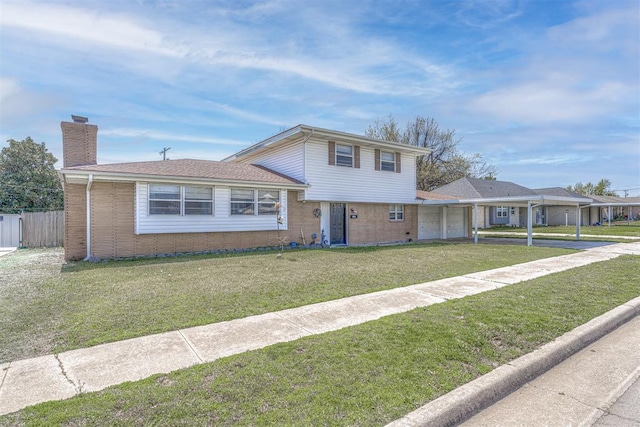 2428 SW 79th St, Oklahoma City, OK 73159 - split level home with brick siding, an attached garage, driveway, and a chimney
