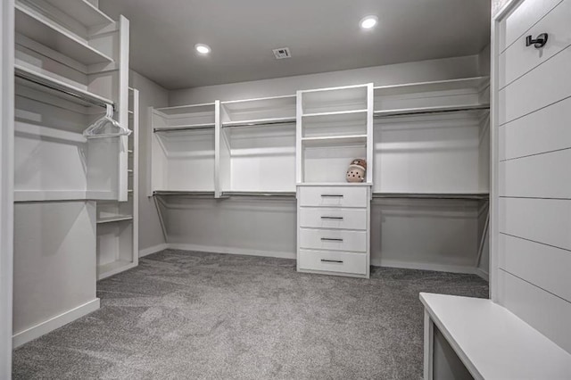 spacious closet featuring visible vents and carpet