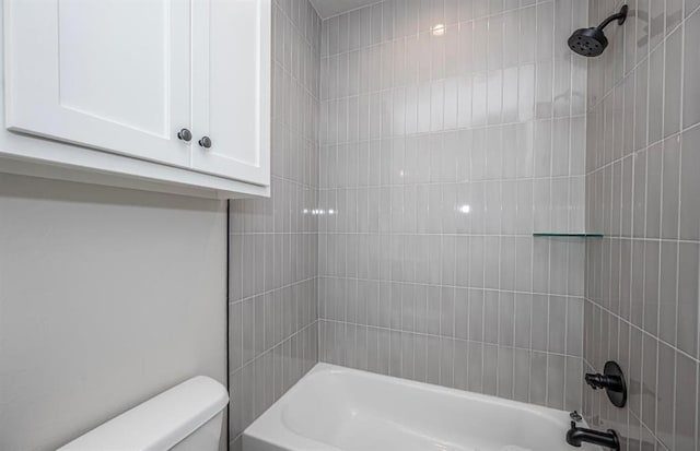 bathroom with toilet and  shower combination